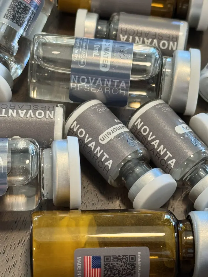 Novanta Research product photo of labeled research vials, including a BPC-157 vial and bacteriostatic water.